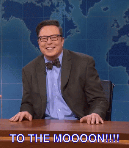 A Man In A Suit And Bow Tie Is Sitting At A Desk With The Words " To The Moooon !!! " Above Him GIF