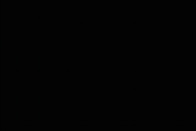 A Man In A Suit And Bow Tie Is Sitting In Front Of A Sign That Says Absolute Cinema 007 GIF