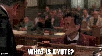 A Man In A Suit And Bow Tie Is Talking To Another Man In A Suit And Bow Tie In A Courtroom . GIF