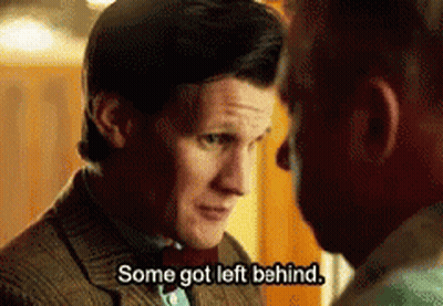 A Man In A Suit And Bow Tie Is Talking To Another Man Who Says Some Got Left Behind GIF