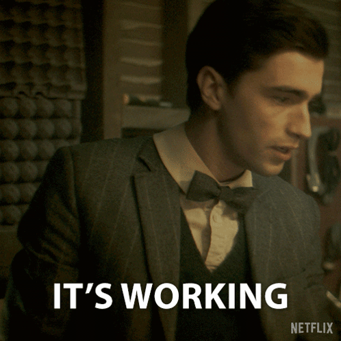 A Man In A Suit And Bow Tie Says It 'S Working Netflix GIF