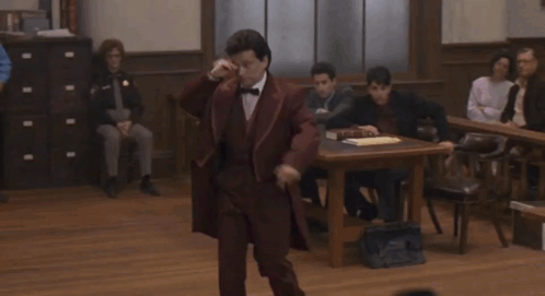 A Man In A Suit And Bow Tie Stands In Front Of A Group Of People With The Words " Everything That Guy Just Said " Below  GIF