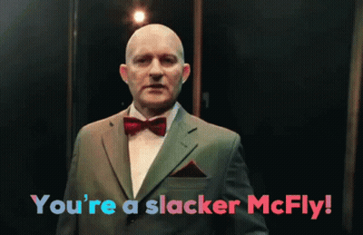 A Man In A Suit And Bow Tie With The Words You 'Re A Slacker Mcfly GIF