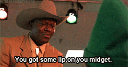 A Man In A Suit And Cowboy Hat Says You Got Some Lip On You Midget GIF