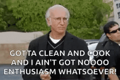A Man In A Suit And Glasses Is Standing In Front Of A Car With A Quote . GIF