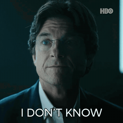A Man In A Suit And Glasses Says I Don T Know GIF