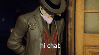 A Man In A Suit And Hat Is Standing In A Doorway And Says Hi Chat GIF