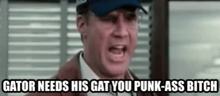 A Man In A Suit And Hat Is Yelling At Another Man In A Hat . GIF