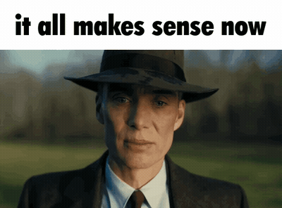 A Man In A Suit And Hat With The Words " It All Makes Sense Now " Below Him GIF