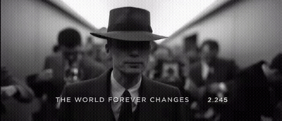 A Man In A Suit And Hat With The Words " The World Forever Changes " On The Bottom GIF
