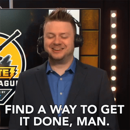 A Man In A Suit And Headphones Says " Find A Way To Get It Done Man " GIF