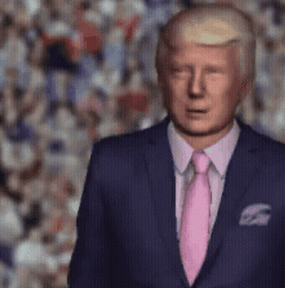 A Man In A Suit And Pink Tie Stands In Front Of A Crowd . GIF