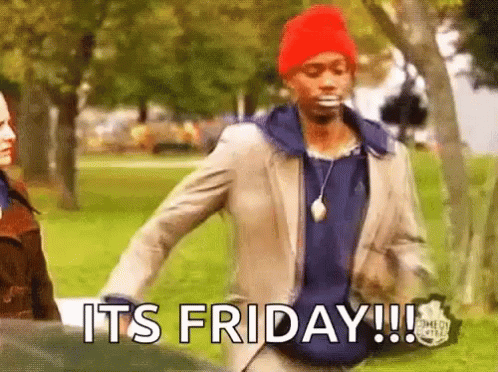 A Man In A Suit And Red Hat Is Walking In A Park With The Words `` It 'S Friday '' Written On His Face . GIF