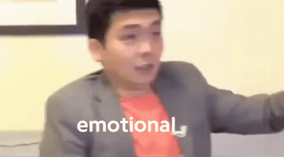 A Man In A Suit And Red Shirt Is Making A Funny Face And The Word Emotional Is Visible In The Background . GIF