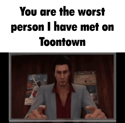 A Man In A Suit And Red Shirt Is Pointing At The Camera While Talking To Someone . GIF