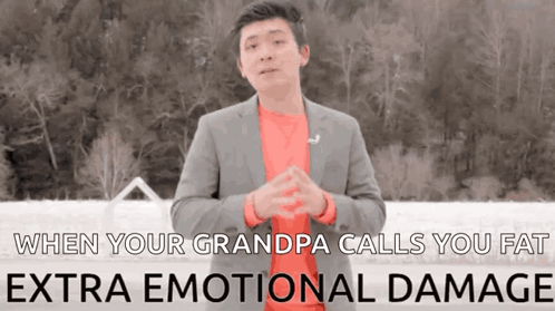 A Man In A Suit And Red Shirt Is Talking About When Your Grandpa Calls You Fat Extra Emotional Damage . GIF