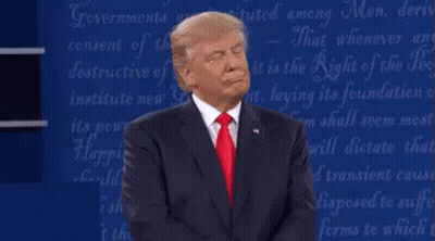 A Man In A Suit And Red Tie Is Standing In Front Of A Blue Board With The Words " Governments " On It GIF