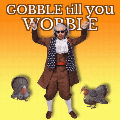 A Man In A Suit And Scarf Is Standing In Front Of Two Turkeys And The Words Gobble Till You Wobble GIF