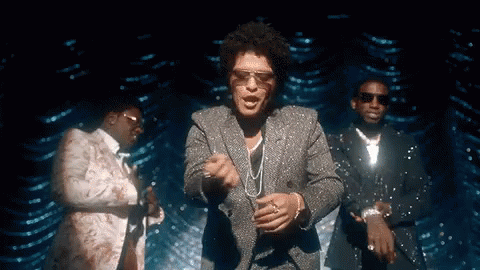 A Man In A Suit And Sunglasses Is Dancing With Two Other Men In Suits . GIF