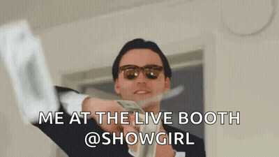 A Man In A Suit And Sunglasses Is Holding A Bunch Of Money In His Hands . GIF