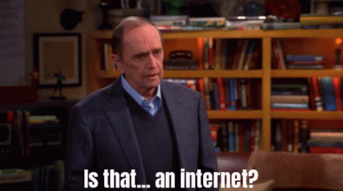 A Man In A Suit And Sweater Is Asking Is That An Internet GIF