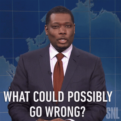 A Man In A Suit And Tie Asks What Could Possibly Go Wrong GIF