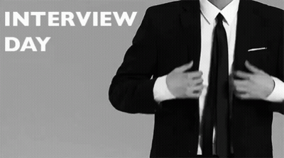 A Man In A Suit And Tie Getting Ready For An Interview Day GIF