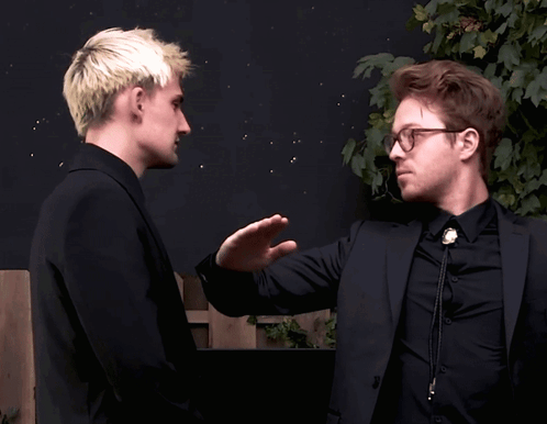 A Man In A Suit And Tie Giving Another Man A High Five GIF