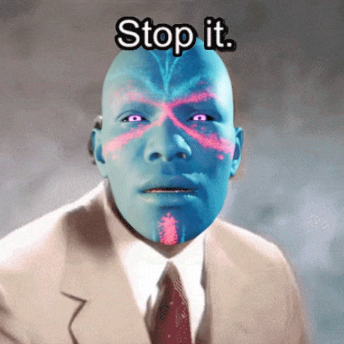 A Man In A Suit And Tie Has A Blue Face And The Words Stop It Above Him GIF