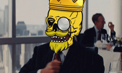 A Man In A Suit And Tie Has A Cartoon Skull With A Crown On His Head GIF