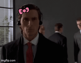 Man In Suit With Hello Kitty Bow On Forehead GIF