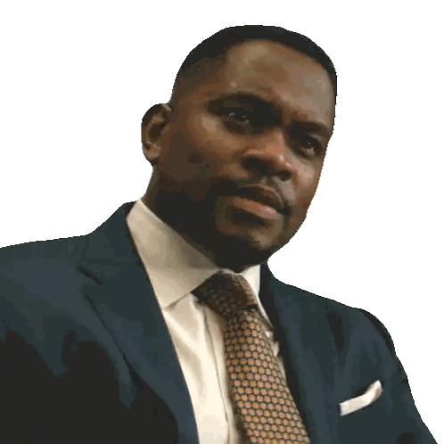 A Man In A Suit And Tie Has A White Pocket Square Sticker