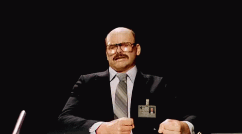 A Man In A Suit And Tie Has Blood Coming Out Of His Head While Wearing A Badge That Says ' A ' GIF
