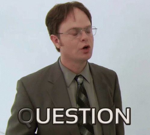 A Man In A Suit And Tie Has The Word Question Written On His Chest GIF
