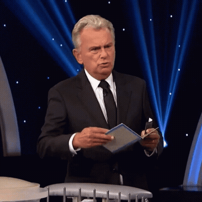 A Man In A Suit And Tie Holds A Box That Says One Million GIF