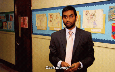 A Man In A Suit And Tie Holds A Cell Phone And Says Cash Money GIF