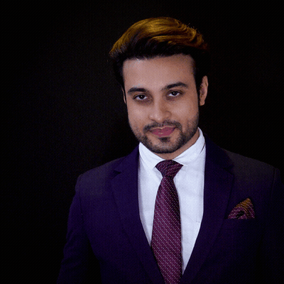 A Man In A Suit And Tie Holds A Glass In Front Of His Face With The Words For Your Success Written Below Him GIF