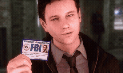 A Man In A Suit And Tie Holds Up A Badge From The Department Of Investigation Fbi GIF