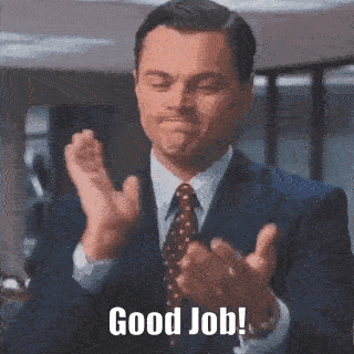 A Man In A Suit And Tie Is Applauding With The Words Good Job Written Below Him GIF