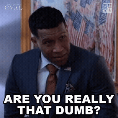 A Man In A Suit And Tie Is Asking Are You Really That Dumb . GIF
