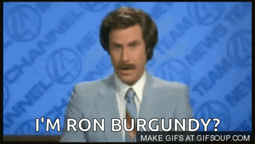 A Man In A Suit And Tie Is Asking If He Is Ron Burgundy GIF