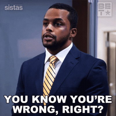 A Man In A Suit And Tie Is Asking If He Is Wrong GIF