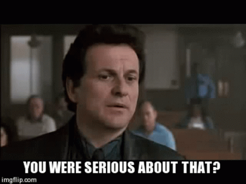 A Man In A Suit And Tie Is Asking If He Was Serious About That . GIF
