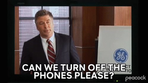 A Man In A Suit And Tie Is Asking If We Can Turn Off The Phones GIF