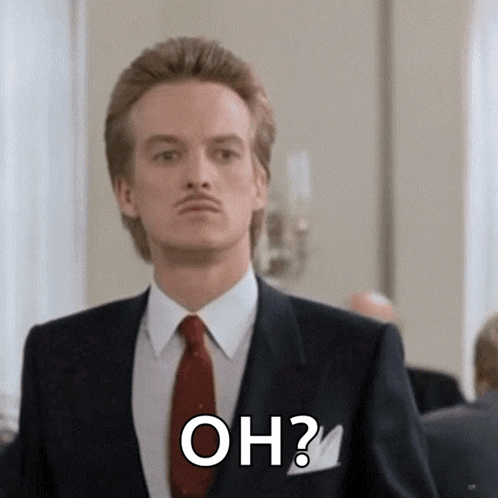 A Man In A Suit And Tie Is Asking The Question " Oh " GIF