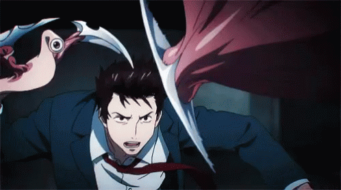 A Man In A Suit And Tie Is Being Attacked By A Monster . GIF