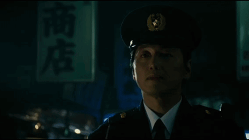 A Man In A Suit And Tie Is Being Attacked By A Monster With Long Tentacles GIF
