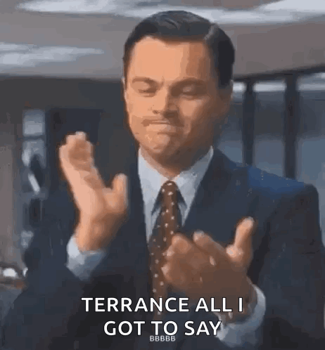 A Man In A Suit And Tie Is Clapping His Hands And Saying Terrace All I Got To Say . GIF