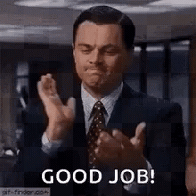 A Man In A Suit And Tie Is Clapping His Hands And Says `` Good Job '' . GIF