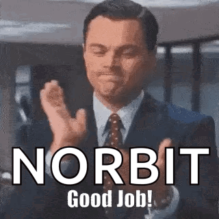 A Man In A Suit And Tie Is Clapping His Hands With The Words Norbit Good Job . GIF